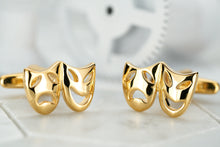 An image of a pair of Dear Martian gold costume mask cufflink accessories for men.
