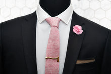 Dear Martian's pink linen tie featured on a mannequin wearing the Kloven gold axe tie clip as well as a gingham floral lapel pin and our brown linen pocket square.