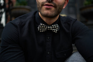 Image of the bugsy black and white bow tie posing for Father's Day blog.