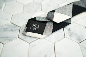 The back Dear Martian, argyle tie portrays a hand stitched DM hexagonal logo on the tipping.