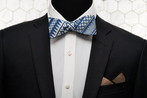 An image of a Dear Martian mannequin dressed in our aztec blue self tie bow tie and rocking our stylish brown arbuckle pocket square.