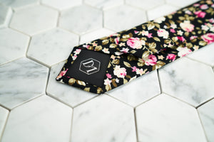 The Posite slim necktie portrays the DM signature hexagonal logo on the back.