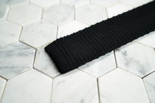 A detailed close up shot of the Dear Martian, Crow Hill black silk men's tie. 