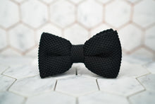 The front image of the Dear Martian, silk knitted bow tie, sitting upon a hexagonal white background.