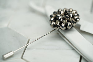 Front image of the Dear Martian beaded grey lapel pin, which has rhinestones for a shimmery effect.