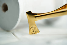 An image portraying the signature DM logo etched onto our DM Kloven gold axe tie clip
