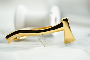 The front image of the Dear Martian men's gold plated axe tie bar. 