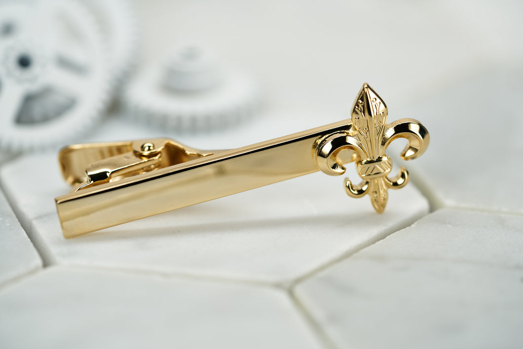 The front image of the Dear Martian Caroll Fleur De Lis gold tie bar.