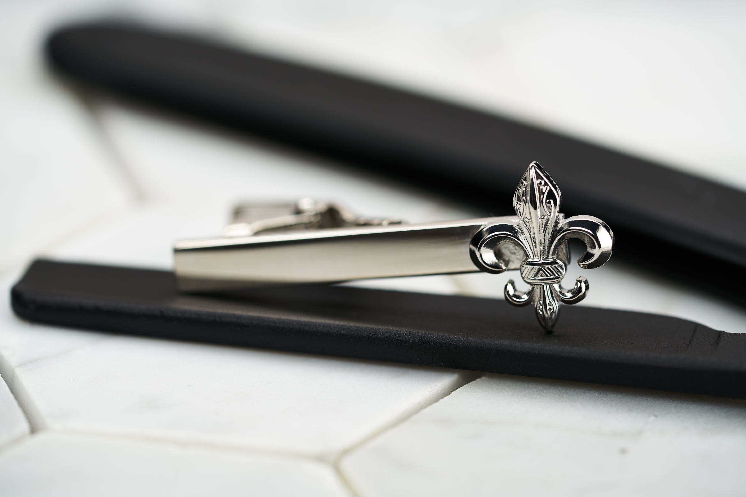 A front image of the Dear Martian, Brooklyn Fleur De lis Tie clip in a steel color.