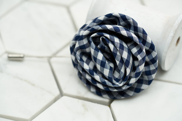 A front image of the stylish gingham flower lapel pin by Dear Martian, Brooklyn.