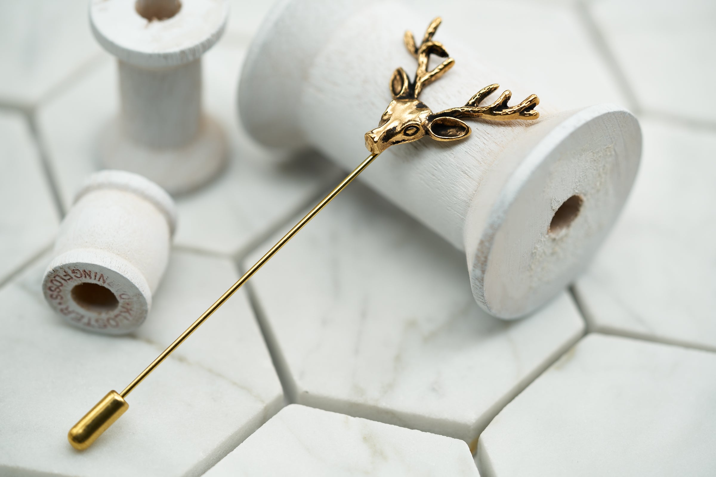 An image of the Dear Martian vintage gold stag lapel pin by Dear Martian.