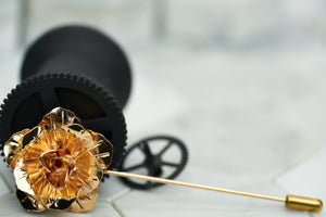 An image of the rose gold flower lapel pin by Dear Martian, Brooklyn.