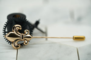 An side view product image of the Carroll gold plated fleur de lis lapel pin by Dear Martian, Brooklyn.