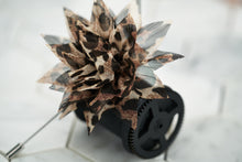 An image of the cheetah patterned boutonniere by Dear Martian.