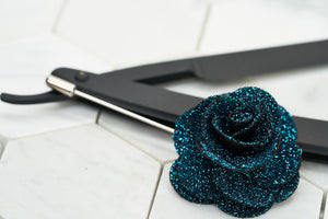 The image of a sparkling navy floral lapel pin handmade by Dear Martian.
