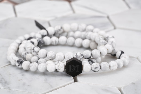 An image of the White Widow multi wrap bead bracelet made with white howlite chakra stone beads.
