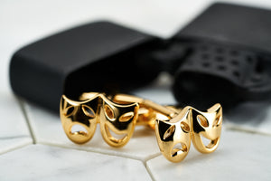 An image of gold plated brass vintage tragedy and comedy mask cufflinks by Dear Martian.