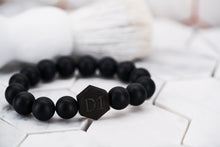 An image of the Dear Martian, BKLYN accessory; featured is an all black chakra stone bead bracelet made from obsidian energy crystals.