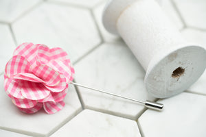 An image of the pink gingham lapel pin for men.