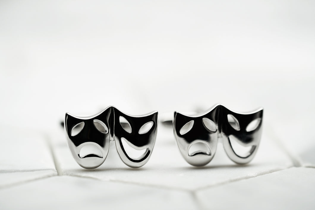 An image of a pair of theatre mask cufflinks for men by Dear Martian, BKLYN.