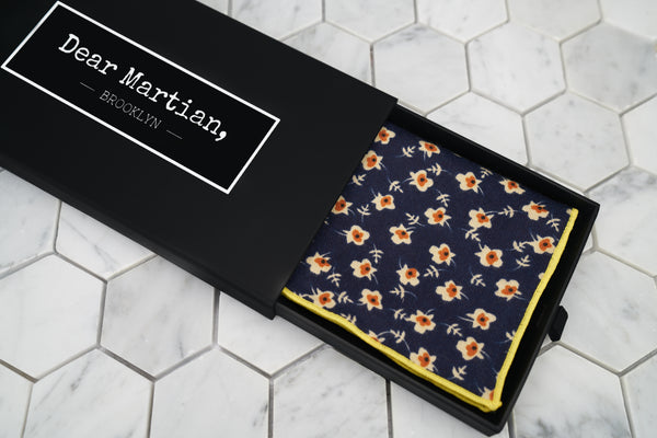 An image of the Dear Martian, Brooklyn black pull-out style box. Inside the box is our sunny eyed floral handkerchief. 