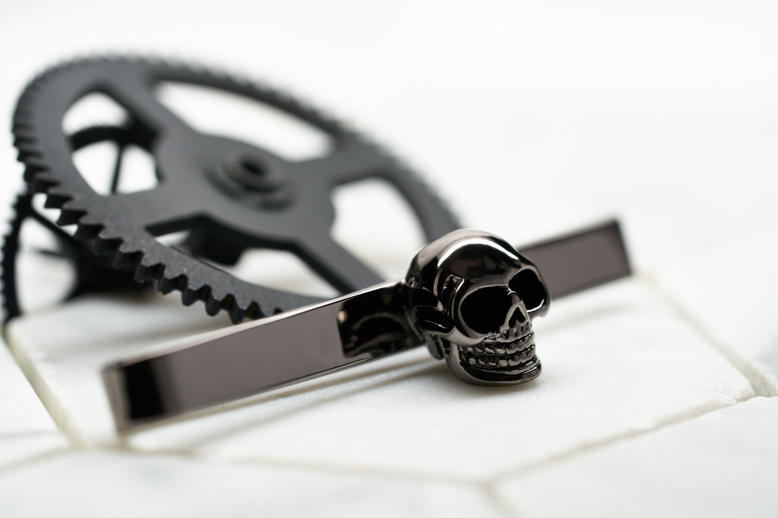 Front image of the Dear Martian Vie Men's Skull Tie Bar with our signature logo.