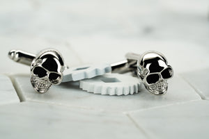 A front image of the Vie handmade silver skull cufflinks from Dear Martian accessories. 