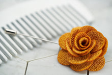 A side view image of the yellow knit summer flower lapel pin.