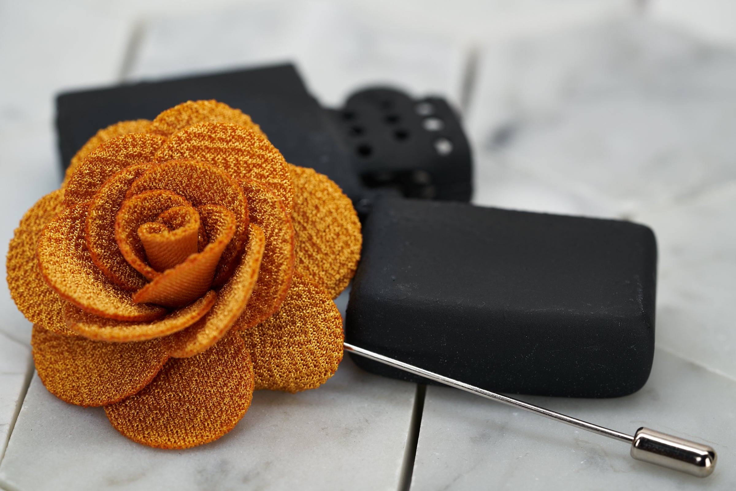 An image of the handmade Dear Martian, yellow brick road knitted flower lapel pin.