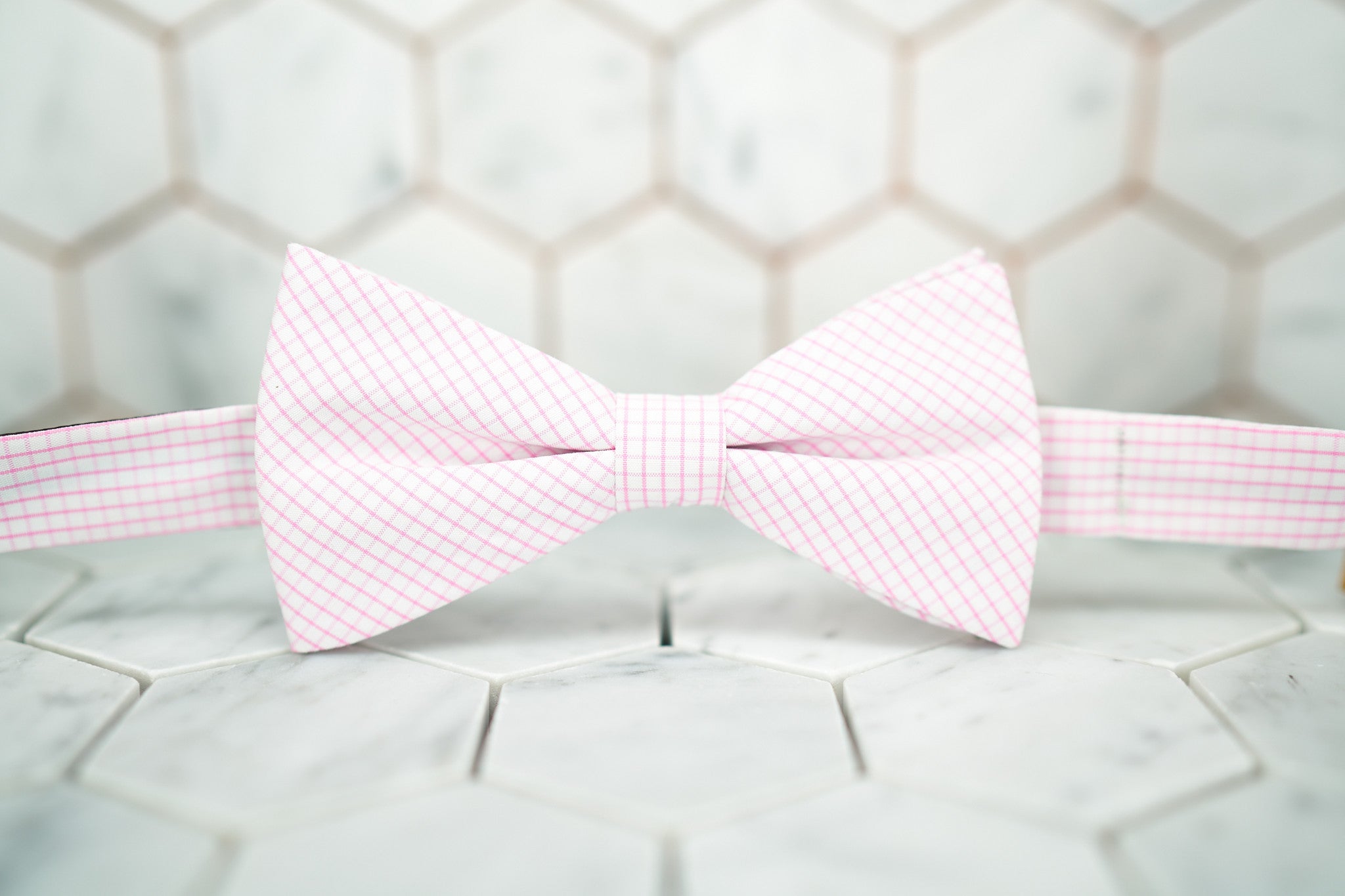 Front view of the pink windowpane bow tie made by Dear Martian, Brooklyn.