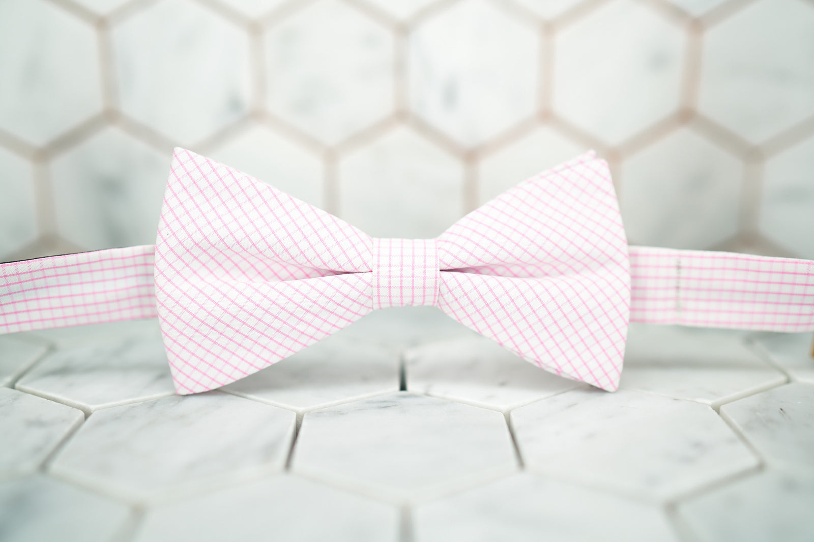 Front view of the pink windowpane bow tie made by Dear Martian, Brooklyn.