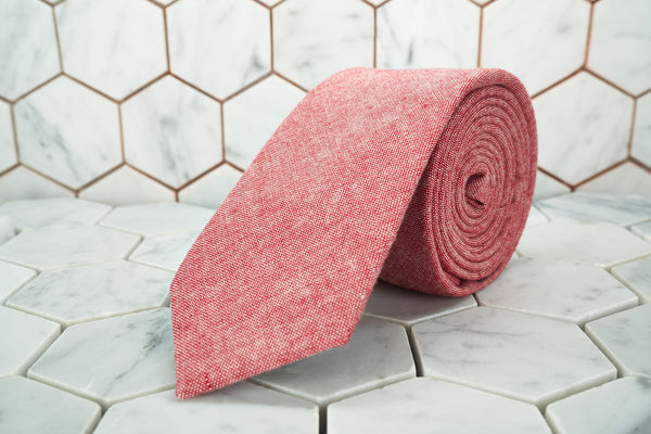 An image of the Haskins Townsend coral red necktie made by Dear Martian.