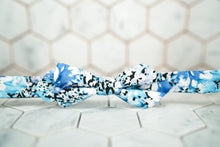The front imageof the Shiota diamond pointed bow tie featuring a blue watercolor style.