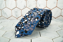 An image of the exclusive Crooke jaguar spotted necktie made by Dear Martian, Brooklyn.