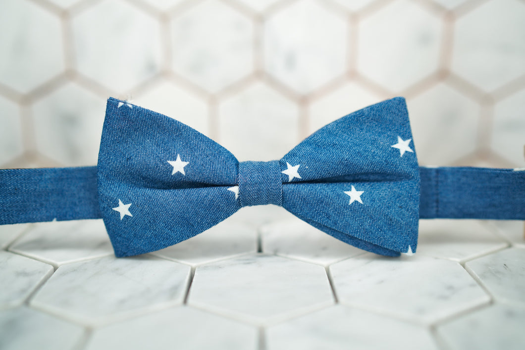 The front image of a denim star patterned bow tie by Dear Martian, Brooklyn.