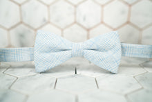 The front image of the Dear Martian Tiffany glen plaid blue bow tie.