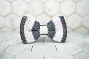 A front image of the silk knitted Dear Martian bow tie, which feature grey and white stripes.